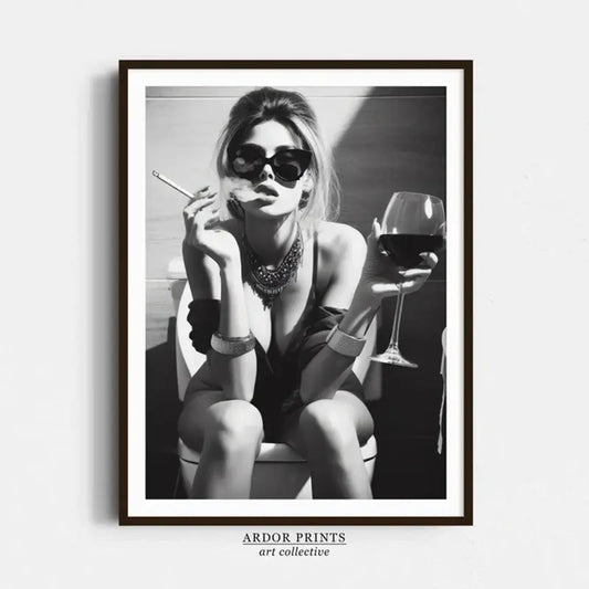 Black and white art print of woman with wine glass and cigarette, stylish home decor