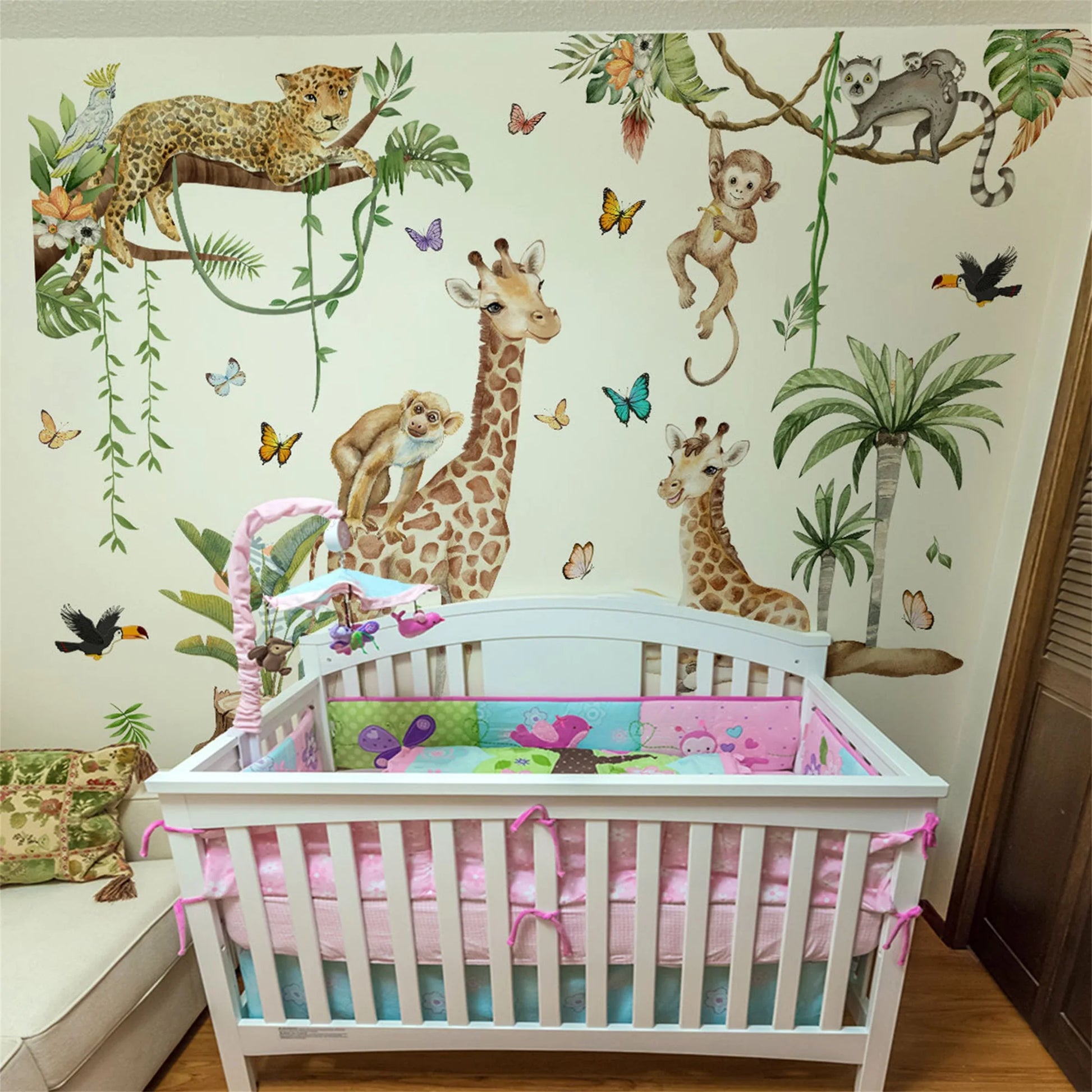 Woodland Animal Wall Decals in a nursery featuring giraffes, monkeys, and tropical elements.