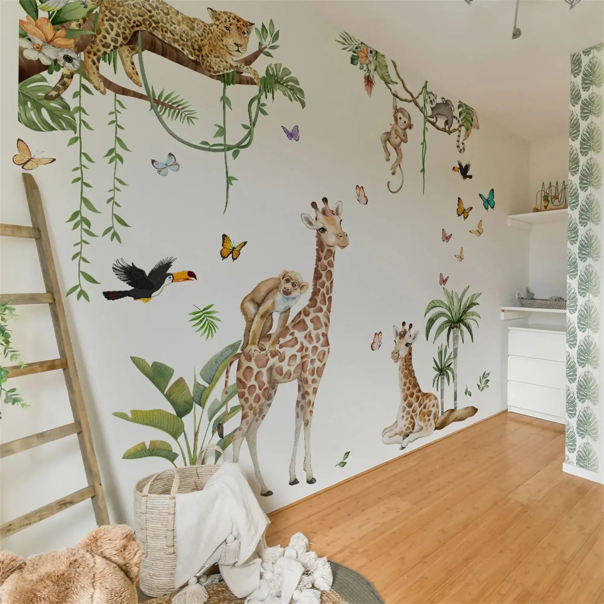 Woodland Animal Wall Decals for Kids nursery featuring giraffes, monkeys, and tropical plants.